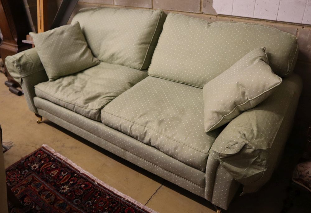 A modern Victorian-style two-seater settee, upholstered in patterned green fabric, width 220cm depth 98cm height 92cm